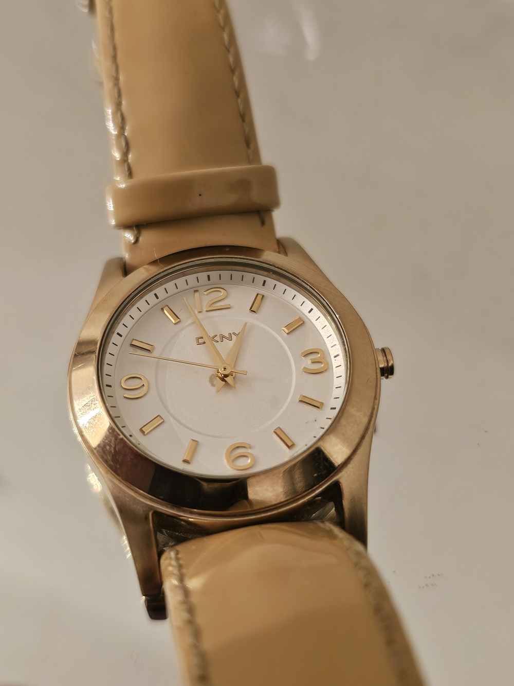 DKNY Gold-Tone Watch with Beige Patent Leather Strap